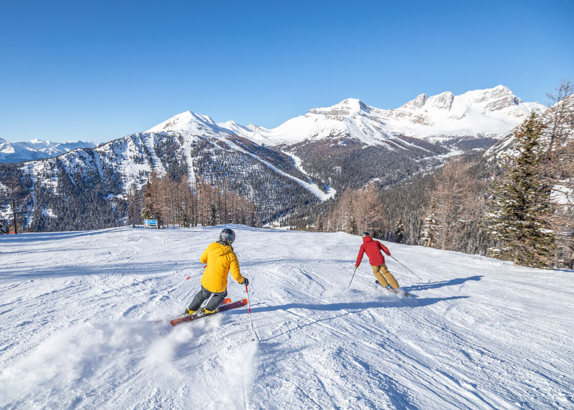 Two skiers at lake louise ski resort in the winter
